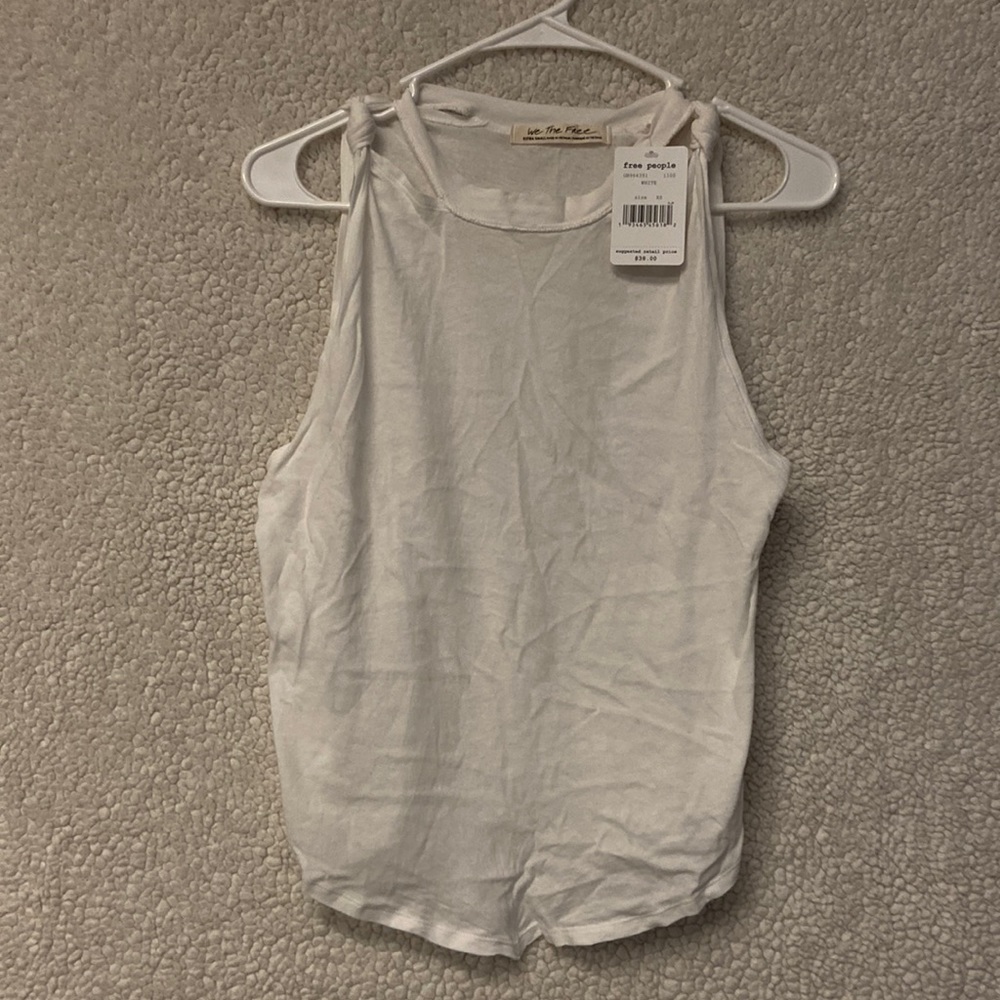Free People “The twist” solid tank top.